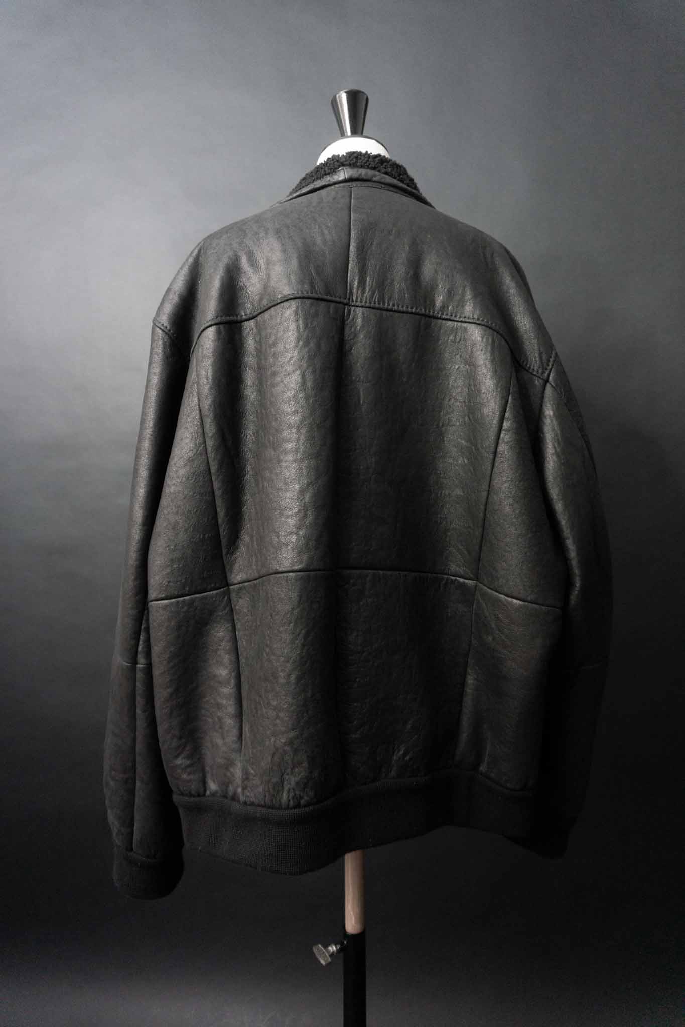 Schwarze Vintage Shearling Bomberjacke aus Lammfell mit Stehkragen