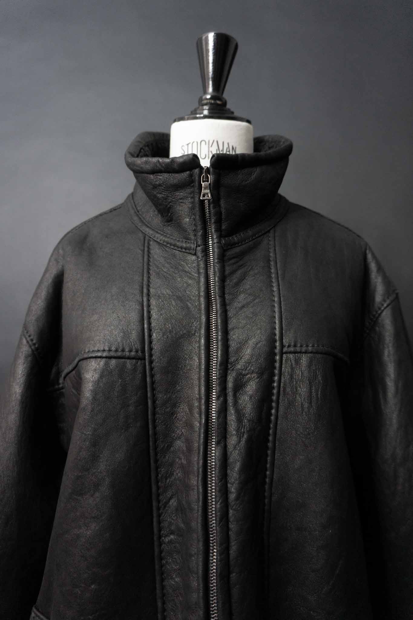 Schwarze Vintage Shearling Bomberjacke aus Lammfell mit Stehkragen