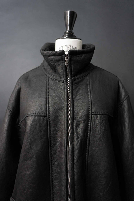 Schwarze Vintage Shearling Bomberjacke aus Lammfell mit Stehkragen