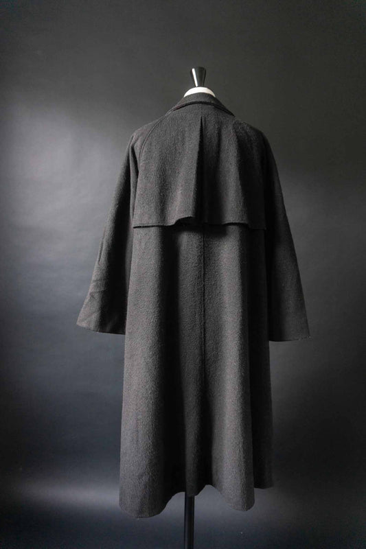 Schwarzer Vintage-Mantel von Kemper aus den 70ern mit Rückenklappe und langer Knopfleiste, aus Wollmix